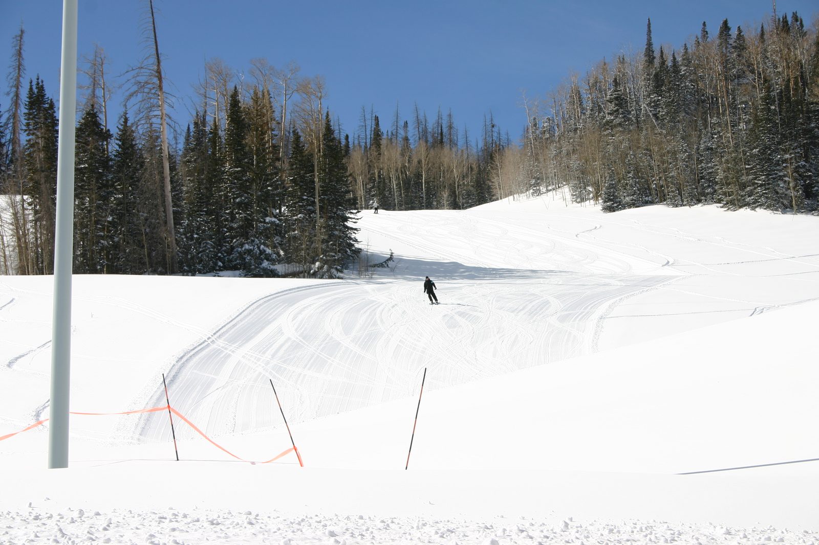 Skier on a groomed Brian Head run